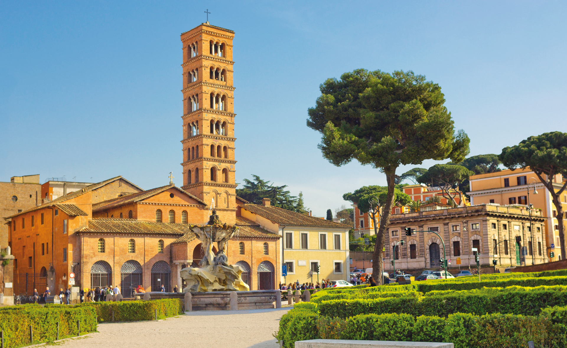Rome, Italy - March 29, 2014: Piazza della Bocca della Verita with fountain and church Santa Maria in Cosmedin